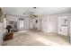 Bright living room with neutral walls and carpet, featuring lots of natural light at 4025 Ne 18Th St, Ocala, FL 34470