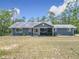 Inviting single-story home with a screened porch and manicured lawn in a serene setting at 4258 Sw Zinnia Ct, Dunnellon, FL 34431