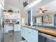 Bright kitchen with stainless steel appliances, butcher block countertops, and breakfast bar, perfect for entertaining at 4258 Sw Zinnia Ct, Dunnellon, FL 34431
