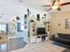 Open-concept living area with decorative shelving, tile floors, and inviting design at 4258 Sw Zinnia Ct, Dunnellon, FL 34431