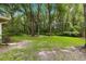 Lush backyard with mature trees offering privacy and a serene, natural setting at 4465 Se 48Th Place Rd, Ocala, FL 34480