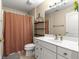 Bathroom featuring decorative shelves, vanity, shower and toilet at 4465 Se 48Th Place Rd, Ocala, FL 34480