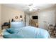 Bedroom featuring ceiling fan, bed, window, plenty of dresser drawer space, and desk space at 4465 Se 48Th Place Rd, Ocala, FL 34480
