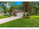 Charming home with a well-maintained lawn, landscaped front yard, and attached two-car garage at 4465 Se 48Th Place Rd, Ocala, FL 34480