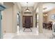Foyer showcasing tile flooring and an elegant entryway to the dining and living areas at 4465 Se 48Th Place Rd, Ocala, FL 34480