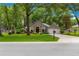 Charming single-story home featuring a lush, green lawn and a well-maintained landscape design at 4465 Se 48Th Place Rd, Ocala, FL 34480