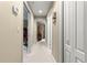Neutral colored hallway with access to multiple rooms at 4465 Se 48Th Place Rd, Ocala, FL 34480