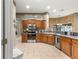 Kitchen with stainless steel appliances, granite countertops, and wooden cabinets at 4465 Se 48Th Place Rd, Ocala, FL 34480