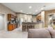 A partial view of the eat-in kitchen and bar with tiled floors and ample cabinetry at 4465 Se 48Th Place Rd, Ocala, FL 34480