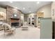 Open-concept living room featuring a stone fireplace and elegant seating area at 4465 Se 48Th Place Rd, Ocala, FL 34480