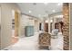 Spacious living room with a fireplace and lots of natural light with seamless flow to other rooms at 4465 Se 48Th Place Rd, Ocala, FL 34480