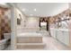 Elegant bathroom featuring a large soaking tub, separate shower, and stylish fixtures at 4465 Se 48Th Place Rd, Ocala, FL 34480