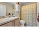 Cozy bathroom with vanity sink, and shower with a patterned curtain at 5151 Sw 39Th St, Ocala, FL 34474