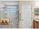 Bathroom featuring a glass shower, vanity with storage, and a linen closet at 5151 Sw 39Th St, Ocala, FL 34474