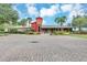 Exterior of clubhouse featuring inviting architecture, well-kept landscaping, and ample parking at 5151 Sw 39Th St, Ocala, FL 34474