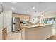 Bright kitchen featuring stainless steel appliances, wood cabinets and a breakfast bar at 5151 Sw 39Th St, Ocala, FL 34474