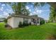Green backyard with a grill at 6127 Sw 84Th Place Rd, Ocala, FL 34476