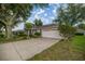Well-maintained single-story home with attached garage and mature landscaping at 6127 Sw 84Th Place Rd, Ocala, FL 34476