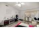 Bright living room with stylish furniture, hanging chair, and a ceiling fan at 6127 Sw 84Th Place Rd, Ocala, FL 34476