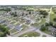 Aerial image of a neighborhood with houses, green lawns, and some backyard pools at 6646 Sw 64Th Ave, Ocala, FL 34476