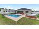 A backyard with a pool, storage shed, and patio seating offer outdoor living at 6646 Sw 64Th Ave, Ocala, FL 34476