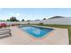 A backyard with a pool and hot tub offers outdoor living and entertaining at 6646 Sw 64Th Ave, Ocala, FL 34476