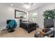 Nicely decorated bedroom with a large mirror, chair, and a comfortable-looking bed at 6646 Sw 64Th Ave, Ocala, FL 34476