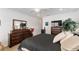 Bedroom features two dressers, a large mirror, and a comfortable, modern bed at 6646 Sw 64Th Ave, Ocala, FL 34476