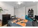 Inviting bedroom with a dresser, bed, and a decorated book shelf at 6646 Sw 64Th Ave, Ocala, FL 34476