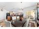 Open concept dining room shows adjacent kitchen and living spaces with sliding glass door at 6646 Sw 64Th Ave, Ocala, FL 34476