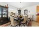 Elegant dining room features a chandelier, hardwood table, and decorative display cabinets at 6646 Sw 64Th Ave, Ocala, FL 34476