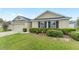 Attractive single-story home with a manicured lawn, two-car garage, and neatly trimmed shrubs adding to its appeal at 6646 Sw 64Th Ave, Ocala, FL 34476