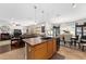 Open concept kitchen includes a center island with a sink and access to the living room at 6646 Sw 64Th Ave, Ocala, FL 34476