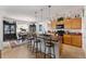Kitchen offers center island with bar stool seating, pendant lights and adjoining dining area at 6646 Sw 64Th Ave, Ocala, FL 34476