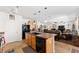 Kitchen with a center island, a sink and an open design flows into the living room and dining area at 6646 Sw 64Th Ave, Ocala, FL 34476