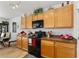 Charming kitchen features modern appliances, wood cabinets and an adjacent dining space at 6646 Sw 64Th Ave, Ocala, FL 34476