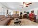 Open-concept living room and kitchen area features hardwood floors and modern decor at 6646 Sw 64Th Ave, Ocala, FL 34476