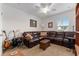 Comfortable living room features a large sectional couch, guitars, and a small table at 6646 Sw 64Th Ave, Ocala, FL 34476