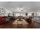Open-concept living room with hardwood floors and comfortable seating at 6646 Sw 64Th Ave, Ocala, FL 34476