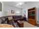 Spacious living room features a large sectional couch, guitars, and a modern TV at 6646 Sw 64Th Ave, Ocala, FL 34476