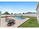 Backyard pool with hot tub and fire pit surrounded by lush landscaping at 6646 Sw 64Th Ave, Ocala, FL 34476