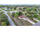 Aerial of a well-situated home with a two-car garage and long driveway, nestled among mature trees in a quiet neighborhood at 70 Sapphire Rd, Ocala, FL 34472