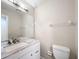Bathroom with granite vanity top, undermount sink, and modern fixtures at 70 Sapphire Rd, Ocala, FL 34472