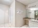 Bathroom area featuring a long vanity with granite counters and a shelf at 70 Sapphire Rd, Ocala, FL 34472