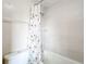 Bathroom featuring white tiled shower with bathtub and silver showerhead at 70 Sapphire Rd, Ocala, FL 34472