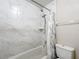 Bright bathroom featuring marble-look tile in the shower and a bathtub at 70 Sapphire Rd, Ocala, FL 34472