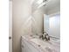 Bathroom featuring granite countertop, undermount sink, and vanity lighting at 70 Sapphire Rd, Ocala, FL 34472
