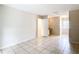 This bedroom features tile flooring, neutral walls, and a convenient vanity area at 70 Sapphire Rd, Ocala, FL 34472
