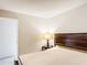 Bedroom featuring a wooden bed frame, side table and accent lamp at 70 Sapphire Rd, Ocala, FL 34472