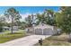 Charming single-Gathering home featuring an attached two-car garage and a chain-link fence surrounding the property at 70 Sapphire Rd, Ocala, FL 34472